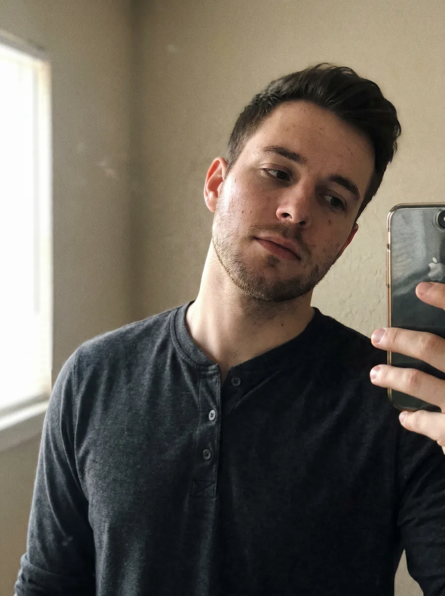 Casual source selfie before generating a professional consultant headshot