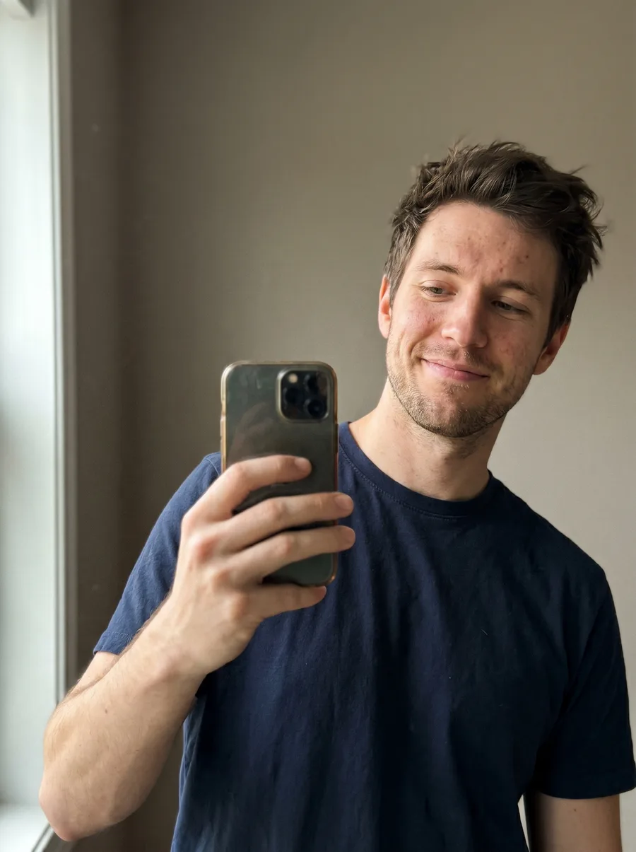 Casual source selfie before generating a senior executive headshot